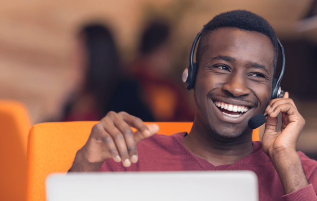 Man smiling while on a call