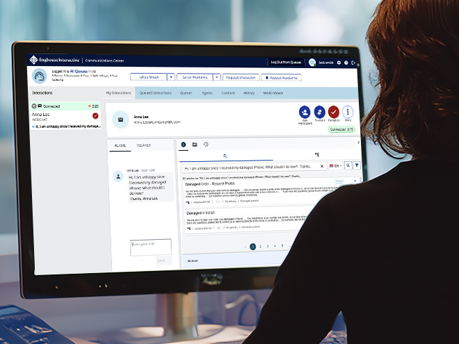 An agent is reviewing a knowledge-base article displayed on a monitor.